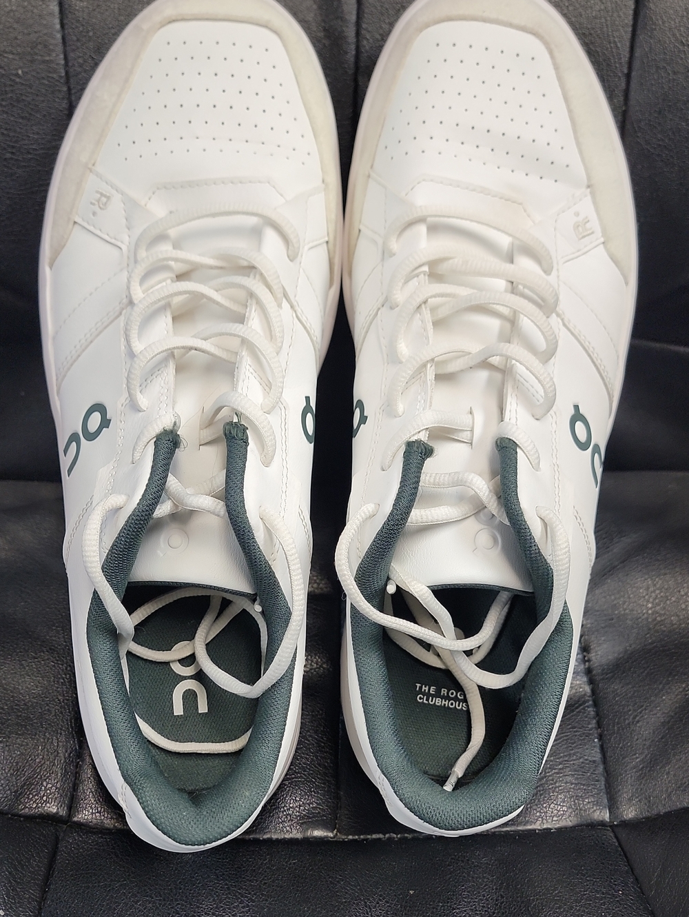 On Running White Sneakers with Green Accents